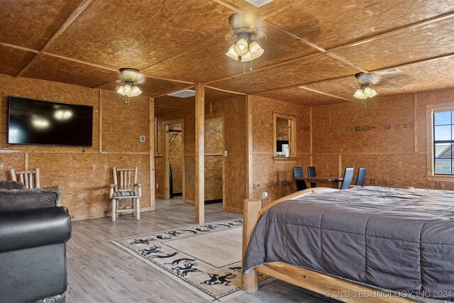 bedroom with ceiling fan and hardwood / wood-style floors