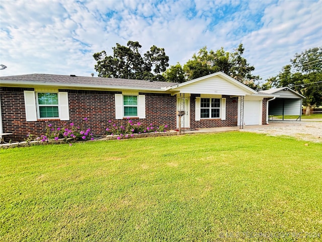 ranch-style home with a garage, a front lawn, and a carport