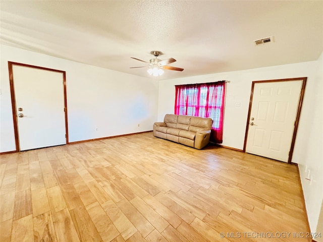 interior space with light hardwood / wood-style flooring and ceiling fan