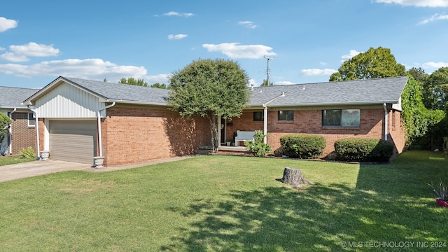 single story home featuring a garage and a front lawn