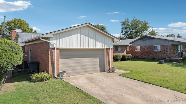 ranch-style home featuring a garage and a front lawn