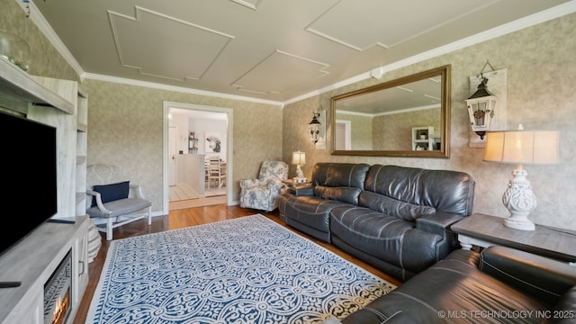 living room featuring ornamental molding and hardwood / wood-style floors