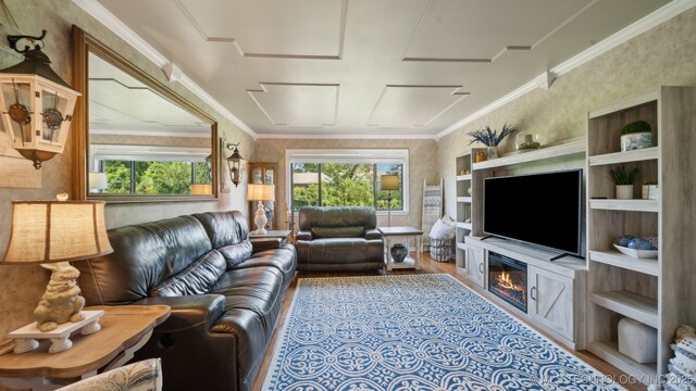 living room featuring hardwood / wood-style flooring and ornamental molding