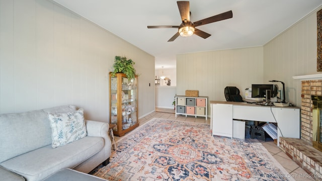 tiled office with a brick fireplace and ceiling fan