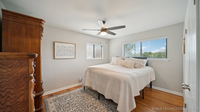 bedroom featuring hardwood / wood-style floors and ceiling fan