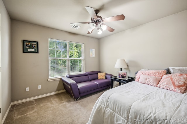 bedroom featuring ceiling fan and light colored carpet