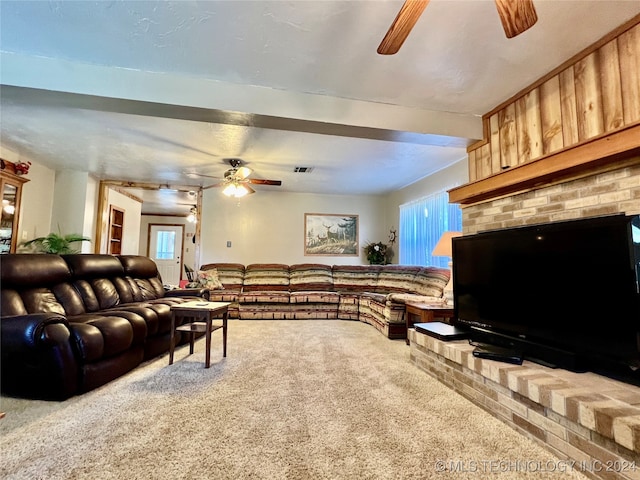 living room with ceiling fan and carpet floors