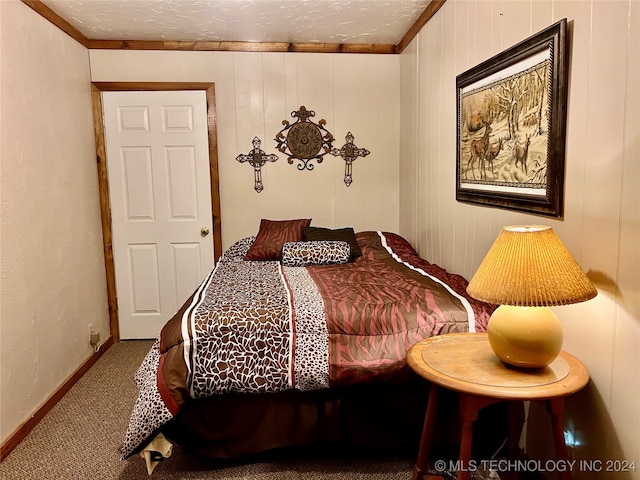 carpeted bedroom featuring crown molding