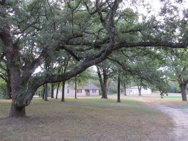 exterior space with a garage and a yard