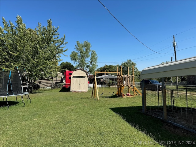 view of yard with a trampoline, a storage shed, and a playground