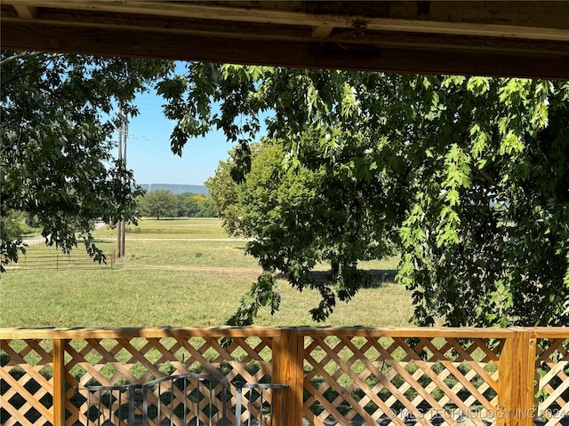 view of yard with a rural view