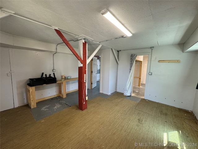 basement with a textured ceiling