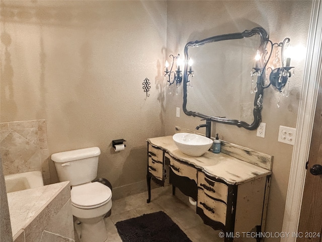 bathroom with vanity, toilet, and tile patterned flooring