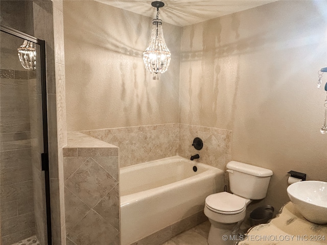 bathroom with tile patterned flooring, separate shower and tub, toilet, and a notable chandelier