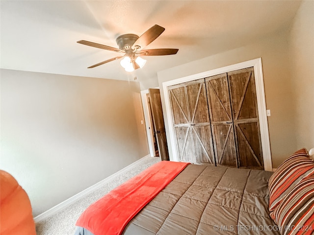 bedroom with ceiling fan and carpet floors