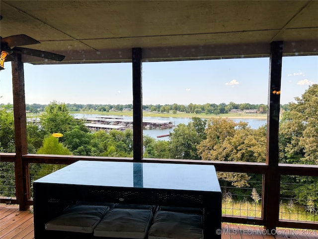 wooden terrace with a water view