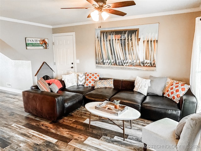 living room with dark wood-type flooring, ceiling fan, and crown molding