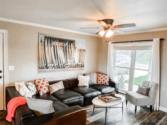 living room featuring ceiling fan, dark hardwood / wood-style floors, crown molding, and a textured ceiling