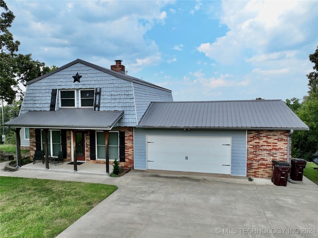 view of front of home featuring a garage and covered porch