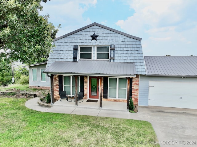 view of front of home featuring a garage and a front yard