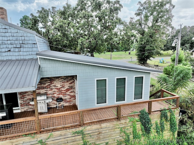 view of side of property featuring a wooden deck