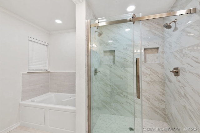 bathroom with independent shower and bath and ornamental molding