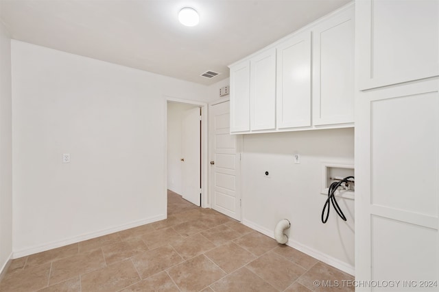 washroom with electric dryer hookup, washer hookup, cabinets, and hookup for a gas dryer