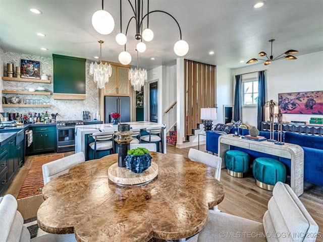 46 Redbud St, Carlton Landing, OK 74432 - dining space featuring a chandelier, stairway, light wood-style flooring, recessed lighting, and bar