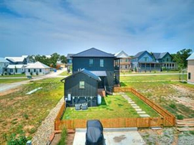 back of property with a residential view