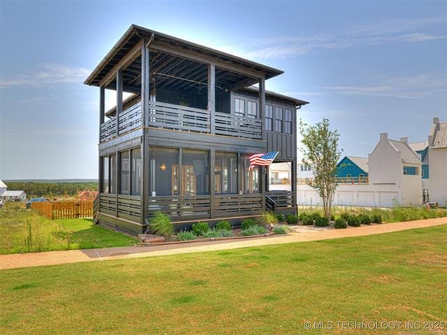 46 Redbud St, Carlton Landing, OK 74432 - view of front of home with a balcony and a sunroom