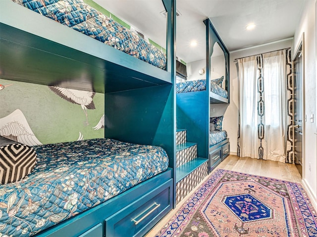 bedroom featuring wood finished floors and recessed lighting