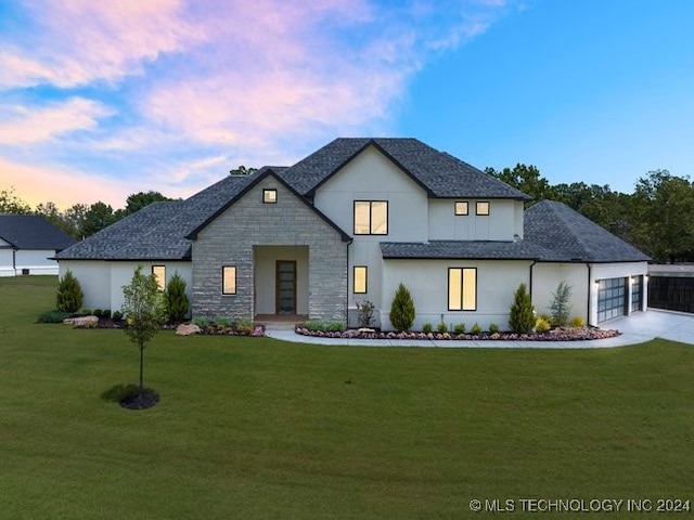 view of front of house with a lawn and a garage