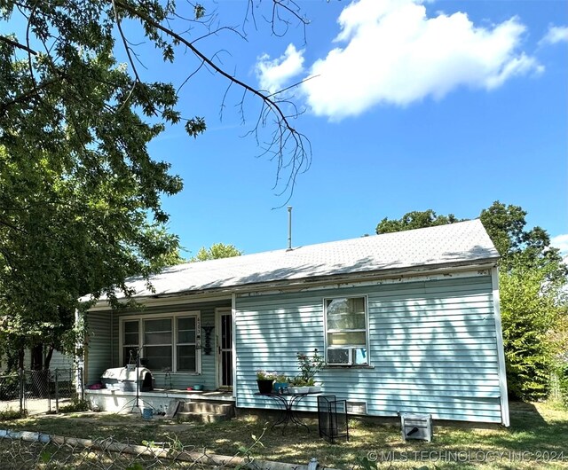 back of property with cooling unit