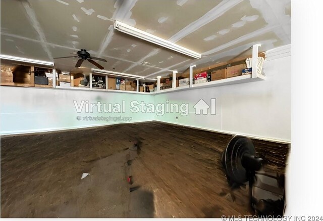 interior space with ceiling fan