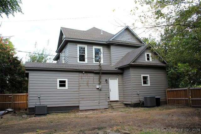 rear view of property featuring central AC unit