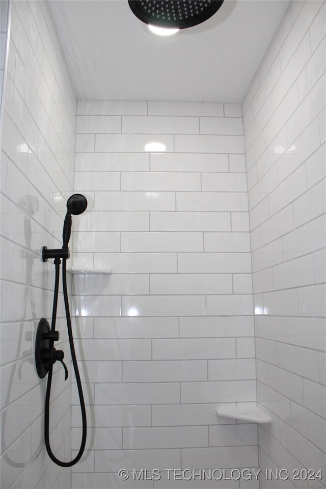 interior space with a tile shower