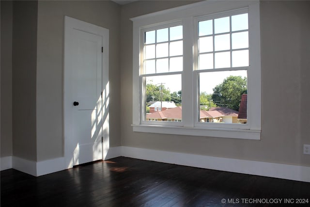 empty room featuring dark wood-style flooring