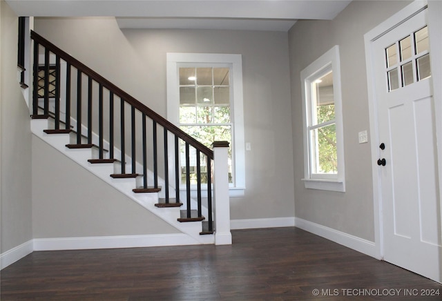 entrance foyer featuring stairway, wood finished floors, and baseboards