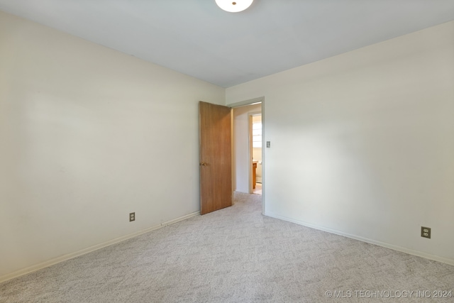 empty room with light colored carpet