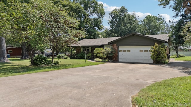 view of front of home with a garage and a front lawn