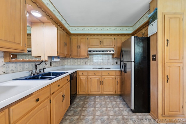 kitchen featuring stainless steel refrigerator, backsplash, sink, white electric stovetop, and black dishwasher