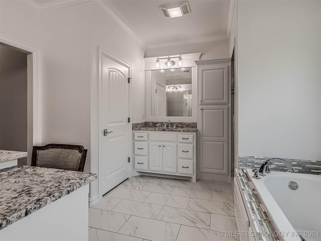 bathroom with ornamental molding, tiled bath, and vanity