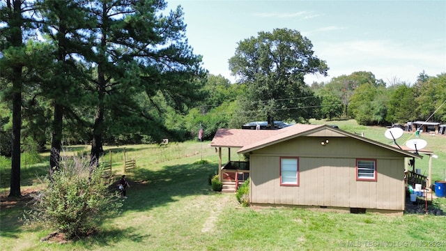 view of property exterior featuring a yard