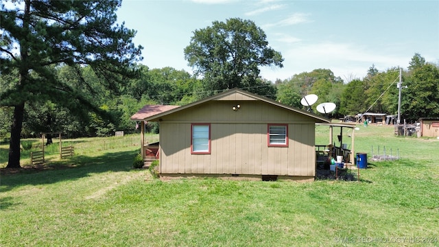 view of property exterior with a lawn