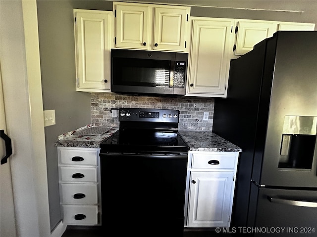 kitchen with white cabinets, dark stone countertops, electric range, fridge with ice dispenser, and tasteful backsplash