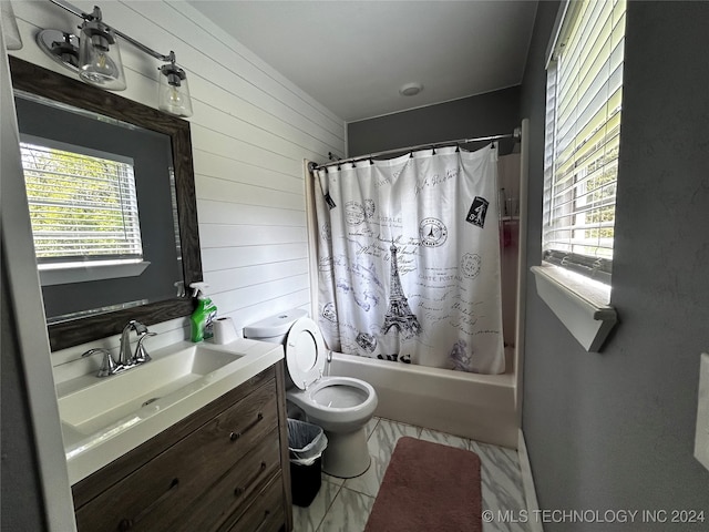 full bathroom with toilet, wooden walls, shower / tub combo with curtain, and vanity