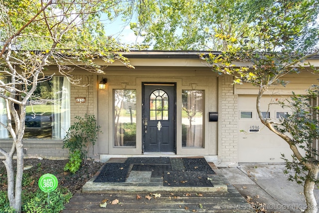 property entrance with a garage