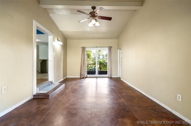 interior space featuring finished concrete floors, lofted ceiling, ceiling fan, and baseboards