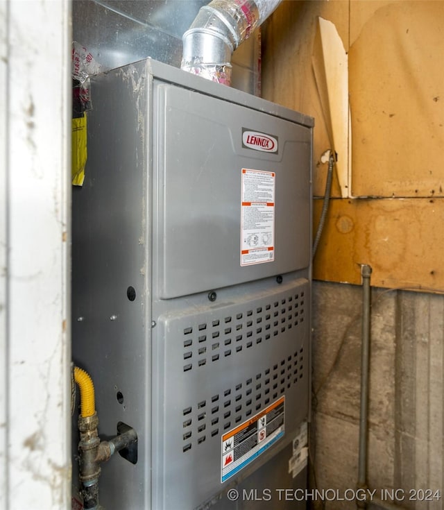 utility room with heating unit