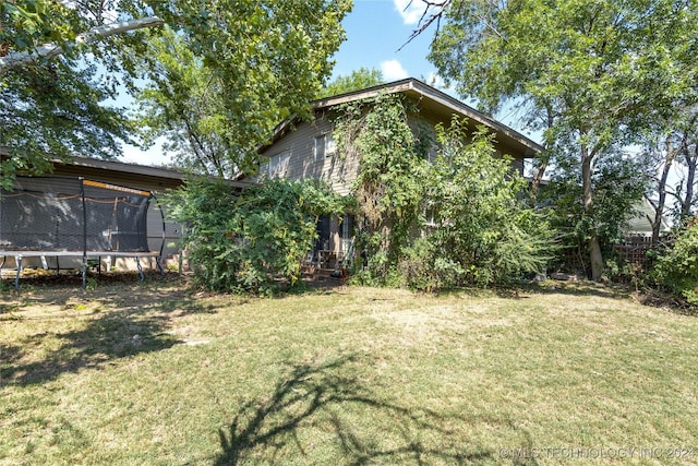 view of yard with a trampoline